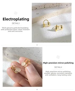 Detail of gold ear cuff with cat eye stone showing high-quality mirror polish finish