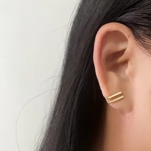 Minimalist double-bar gold cat eye ear cuff with geometric non-piercing design