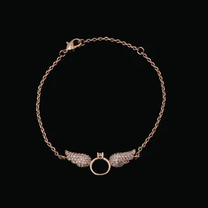Rose gold angel wing bracelet with pavé cubic zirconia on a minimalist cable chain