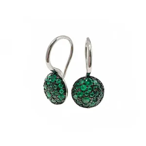 Detailed view of mushroom earrings with green pavé crystals and silver hooks