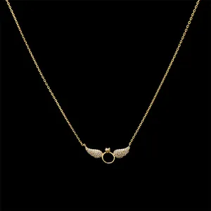 Golden necklace featuring angel wings pendant with a micro-ring and sparkling stones