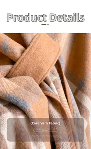 Detail of core-spun yarn scarf with brown and grey plaid pattern showing soft warm texture