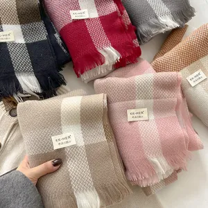 Detailed close-up of wool blend scarves showing soft textures and fringe details