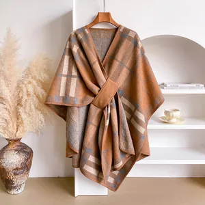 Close-up of the vintage plaid shawl featuring cross-buckle detail and thick knit fabric