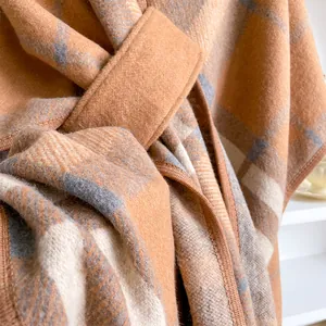 Plaid faux cashmere poncho cape for women featuring orange and grey checkered pattern