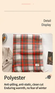 Detailed macro view showing the soft polyester fabric and classic plaid pattern of the scarf
