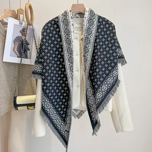 Minimalist triangle scarf with geometric diamond pattern and fringe in black and white