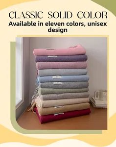 Detail shot of various solid wool scarves with tassels in 11 colors for men and women