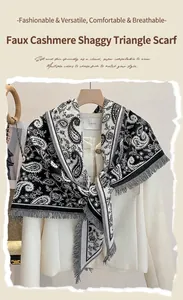 Close-up of black and white paisley triangle scarf with tassel fringe on a tweed jacket