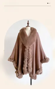 Macro view of plush brown faux rabbit fur trim and smooth fabric on the stylish shawl