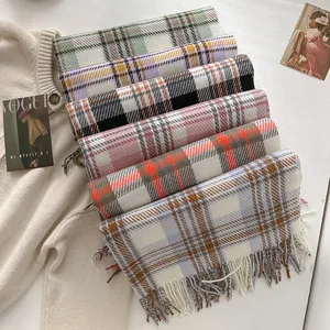 Winter plaid tassel scarves collection in multiple colors on a cozy knit background