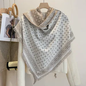 Close-up of diamond pattern knit texture and fringe detail on minimalist triangle shawl
