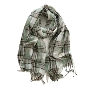 British style green plaid scarf with soft fringe and white woven label on white background
