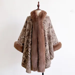 Close-up of brown paisley jacquard cloak with luxurious faux fur trim on the collar