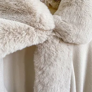 Luxurious beige faux rabbit fur collar cape coat with soft plush texture for winter
