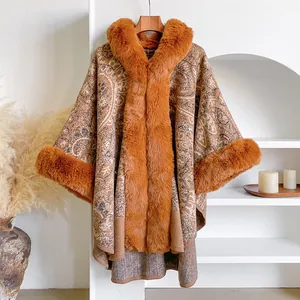 Winter paisley jacquard knit poncho with cozy faux fur trim and bohemian fringe details