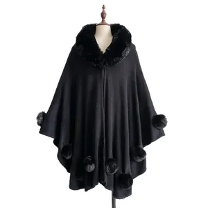 Elegant black faux rabbit fur cape for women with plush collar and decorative pom-poms