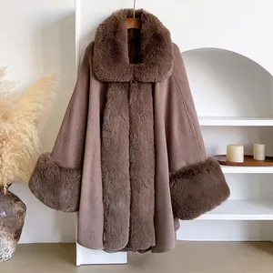 Detail of luxurious brown faux fur trim on wool blend cape coat collar and sleeve cuffs