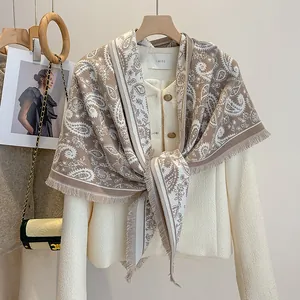 Vintage paisley print fringed shawl with beige tweed jacket and golden buttons décor