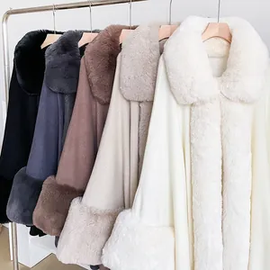 Detail of luxury knit ponchos with thick faux fur collars in five classic colors