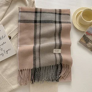 Classic British wool blend plaid scarf with thick tassels and branding label in earth tones