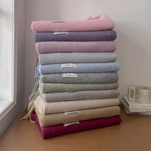 Solid double-sided wool blend scarf with tassels in various soft colors for autumn winter
