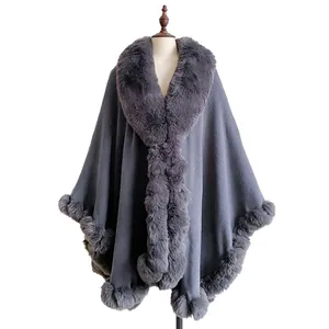 Dark grey oversized wool poncho for women with thick faux rabbit fur collar and trim
