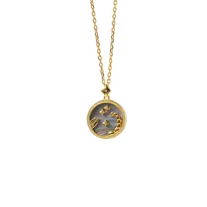 Detailed view of Scorpio zodiac necklace with iridescent shell inlay and gold plating