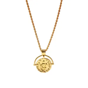 Close-up of gold-plated Roman coin pendant featuring relief detail on a rope chain