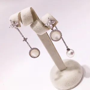 Asymmetric silver earrings with marquise crystals, mother of pearl and a hanging pearl drop
