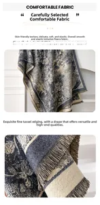 Detail view of floral imitation cashmere scarf with grey-blue fringe tassels and soft texture