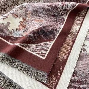 Detailed macro shot of vintage floral tapestry scarf with delicate fringe edges
