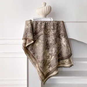 Detail of pashmina scarf with vintage floral landscape print and tassel edges
