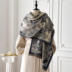 Detail of grey floral toile de jouy pattern cashmere-like scarf with fringe edges