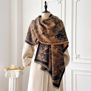 Close-up of Toile de Jouy forest print and soft tassels on a brown cashmere shawl