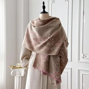 Detail of vintage paisley and houndstooth pashmina shawl with soft fringe trim