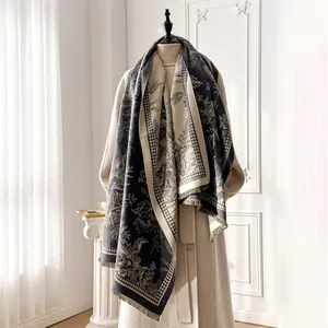 Detail of tropical plant jacquard pattern and houndstooth edge on cashmere scarf