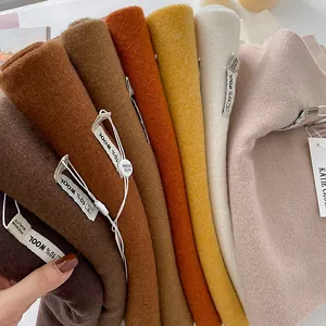 Detailed view of 10% wool blend scarves in a rich color palette with premium quality tags