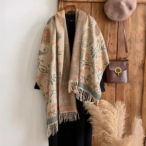 Close-up of bohemian paisley pashmina shawl with thick fringe and detailed floral pattern