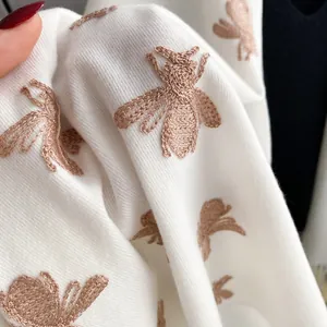 Premium white cashmere feel scarf featuring exquisite gold bee embroidery detail