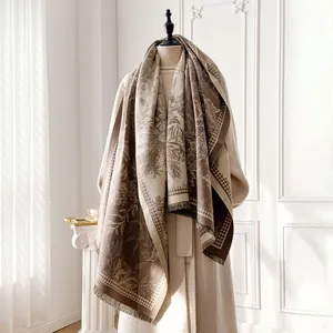 Detail of cashmere scarf showing tropical jacquard patterns and houndstooth fringe edges