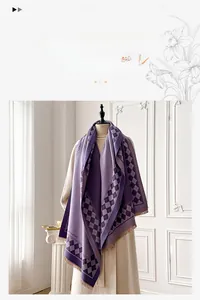 Close-up of purple cashmere-like scarf showing fine tassel details and diamond pattern