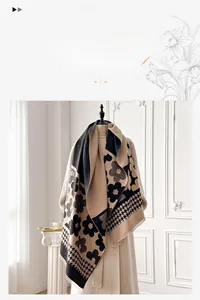 Detail of floral and houndstooth pattern on soft beige cashmere-like winter scarf