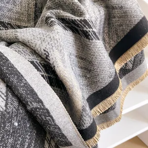 Geometric grey and black faux cashmere scarf with elegant light gold fringe detail