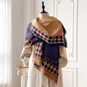 Detail of checkered cashmere-feel scarf with fringes on beige coat in a classic interior