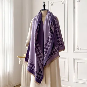 Detail of purple checkerboard cashmere feel scarf with soft tassels on the edge