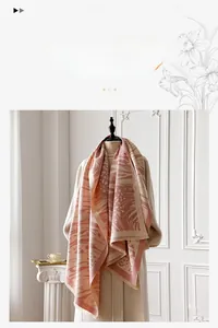 Close-up of pink leopard print imitation cashmere scarf showing soft fringe texture