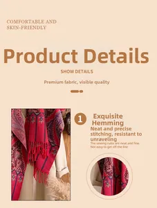 Close-up of vintage floral patterns and fringe details on a red bohemian cashmere shawl