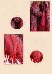 Detail of vintage bohemian shawl showing intricate ethnic patterns and soft red tassels