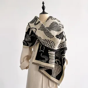 Detail of artistic abstract cat jacquard shawl with soft tassels on the edges